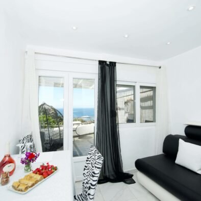 Kitchen - living room table and balcony view - White Star Suite